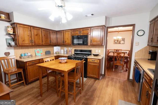 a bedroom with furniture and a chandelier