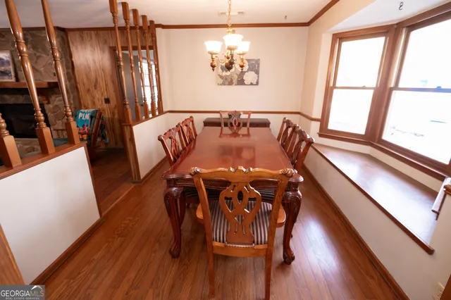 a view of a dining room with furniture window and outside view