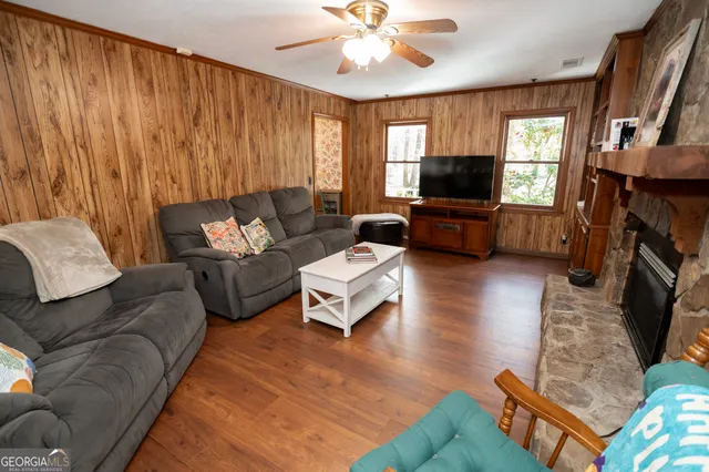 a white toilet sitting next to a bathroom sink and vanity