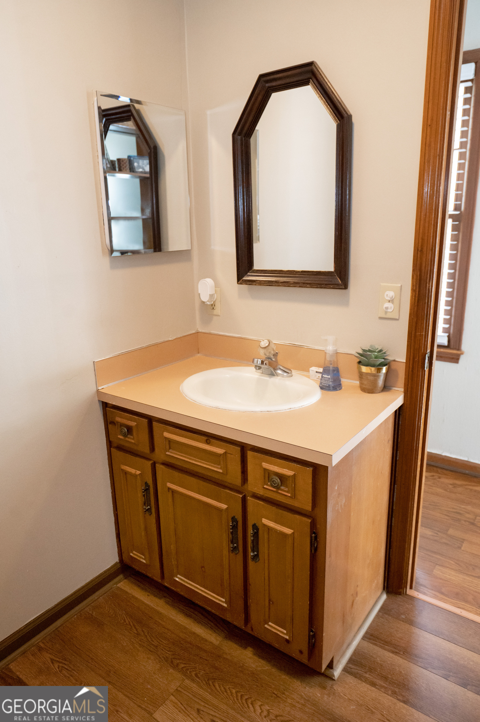 371 Mountain Hill Road Fortson, GA 31808 - Photo 37 of 42 a bathroom with a sink and a mirror