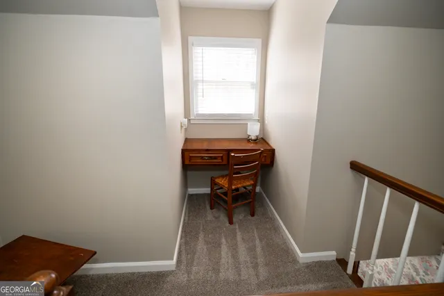 a room with wooden door and a window