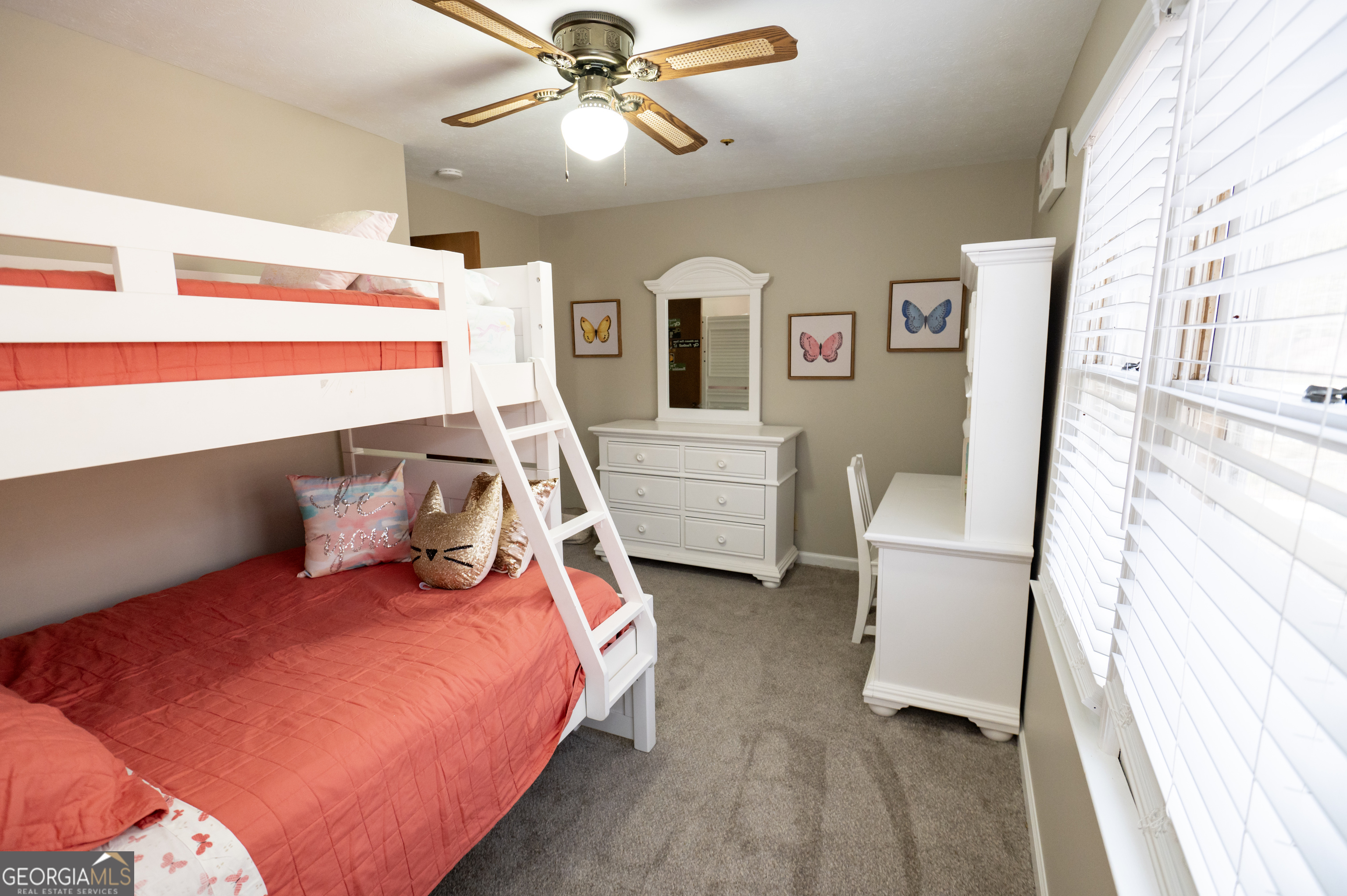 371 Mountain Hill Road Fortson, GA 31808 - Photo 8 of 42 a bedroom with a bed and a chandelier