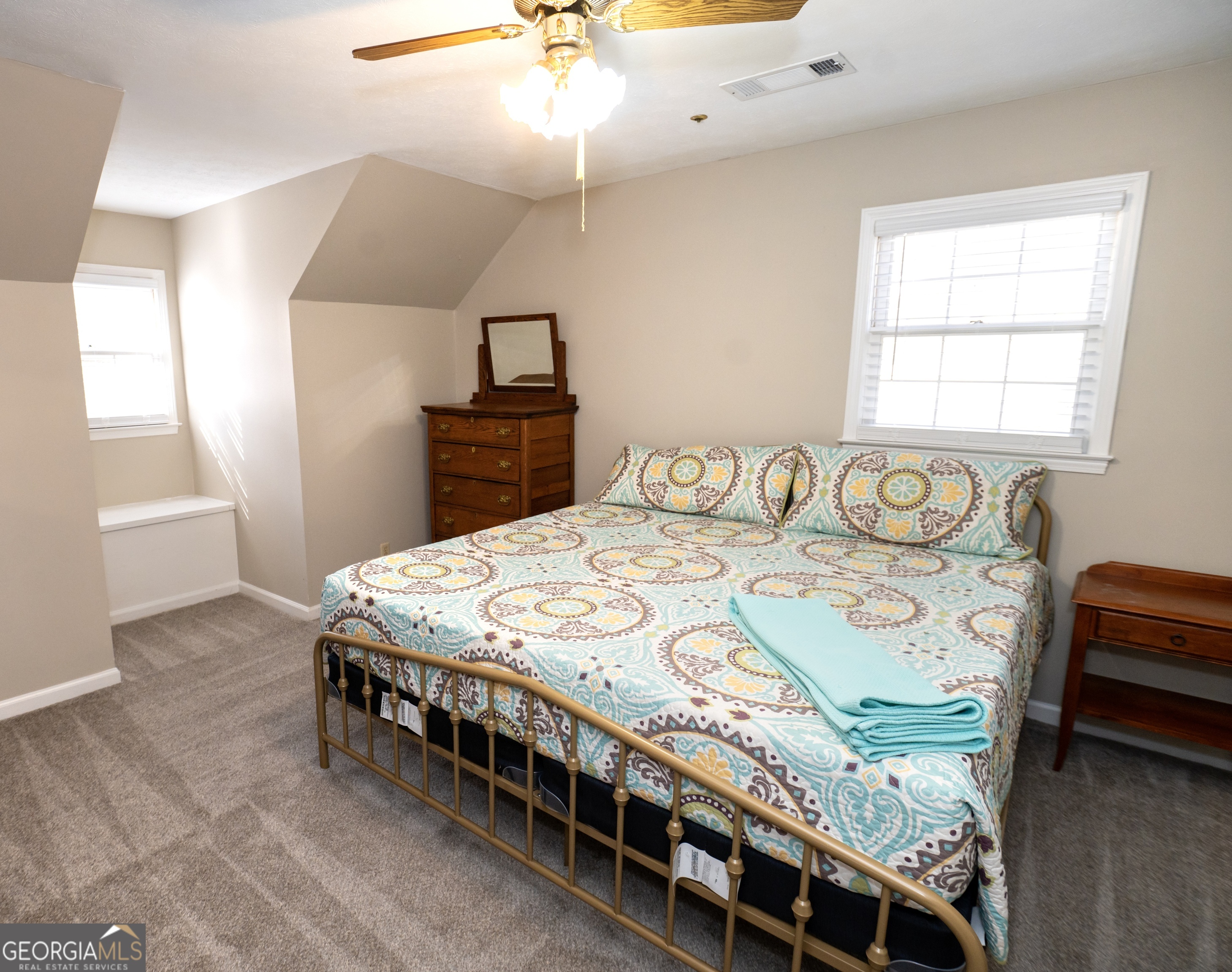 371 Mountain Hill Road Fortson, GA 31808 - Photo 10 of 42 a bed sitting in a bedroom next to a window