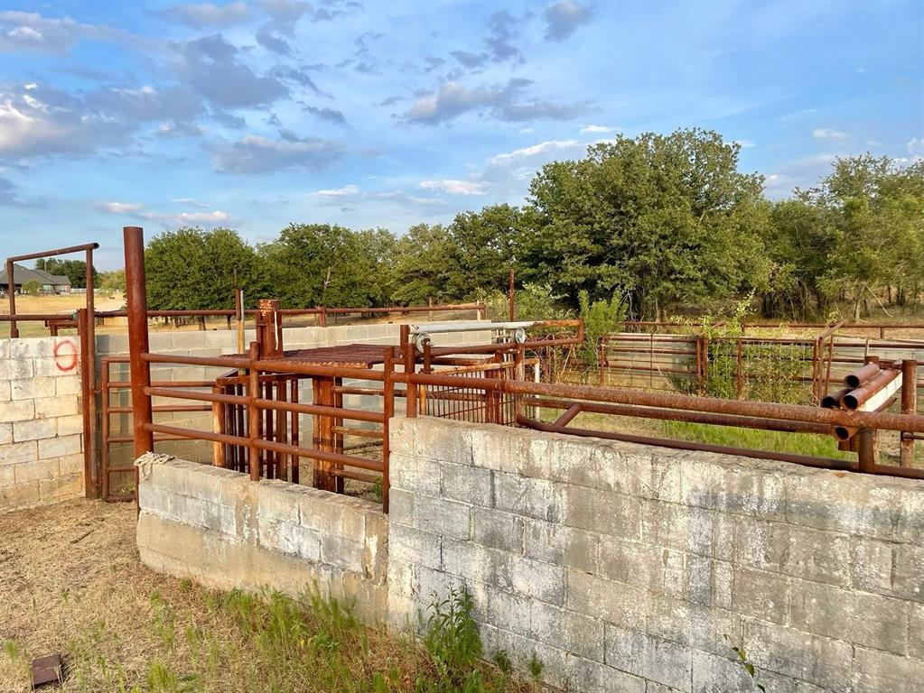 0 Big Salty Lane Springtown, TX 76082 - Photo 13 of 16 a view of a swimming pool with an outdoor seating and a garden