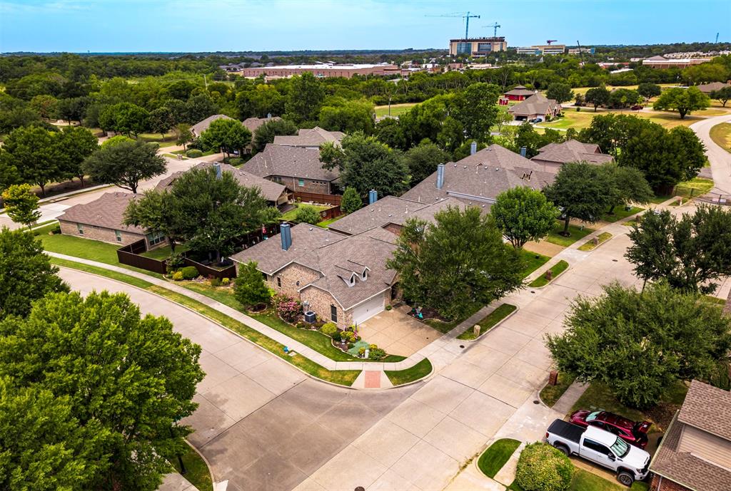 1601 Meadow Ranch Road McKinney, TX 75071 - Photo 25 of 31 Stone and brick exterior residence with an attached garage, situated on a corner lot