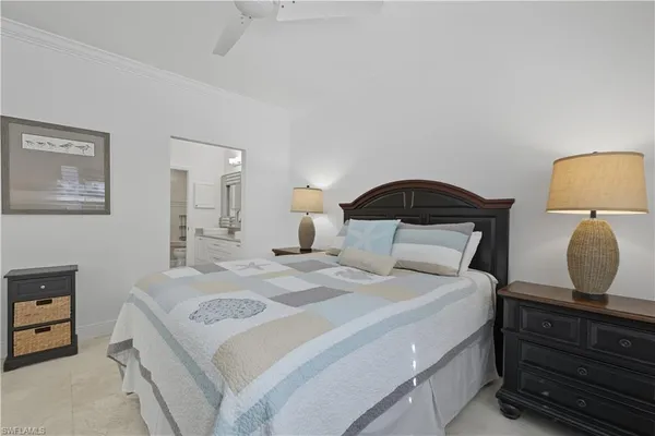 a bedroom with a bed and a mirror