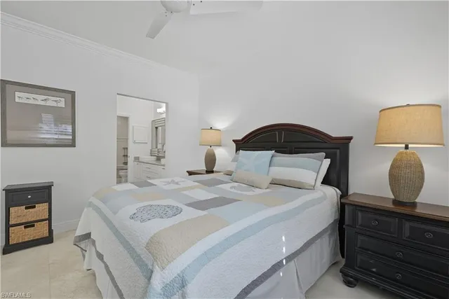 a bedroom with a bed and a mirror