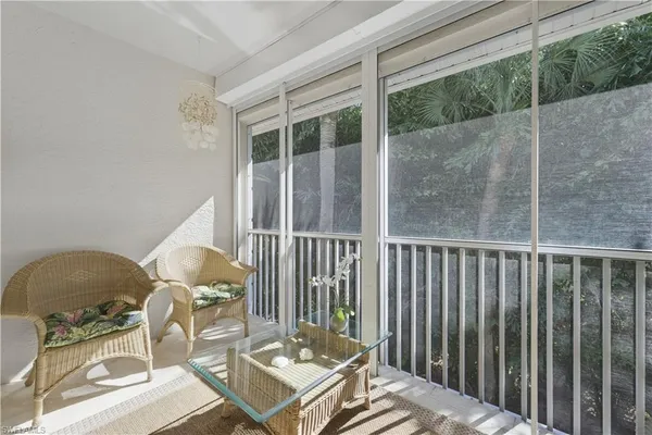 a view of balcony and wooden floor