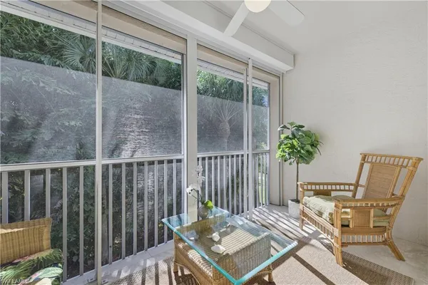 a view of a balcony with furniture