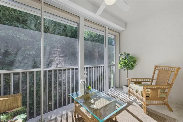 a view of a balcony with furniture