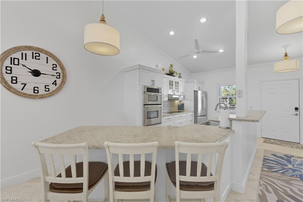 326 Bradstrom Circle, Unit 203F Naples, FL 34113 - Photo 8 of 24 a view of kitchen with sink and refrigerator