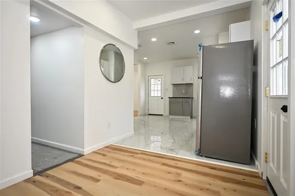 a bathroom with a shower and a mirror