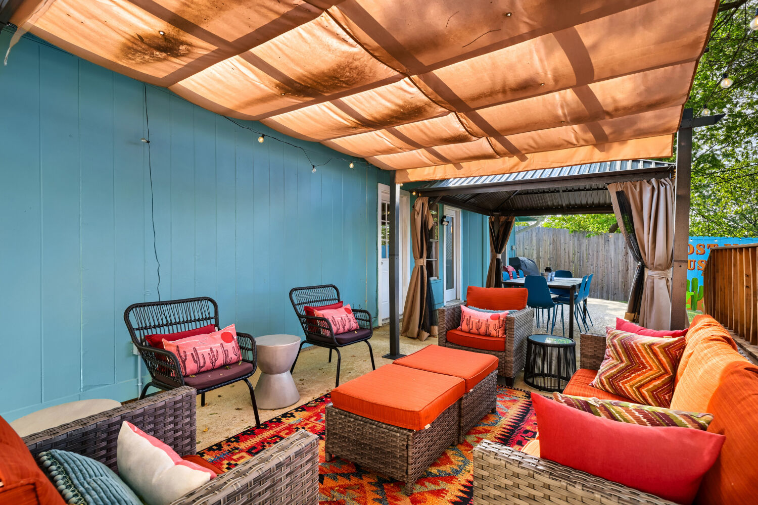 3410 Plantation Road Austin, TX 78745 - Photo 14 of 33 An inviting outdoor living space features a covered patio with comfortable seating, ideal for relaxation and entertaining.