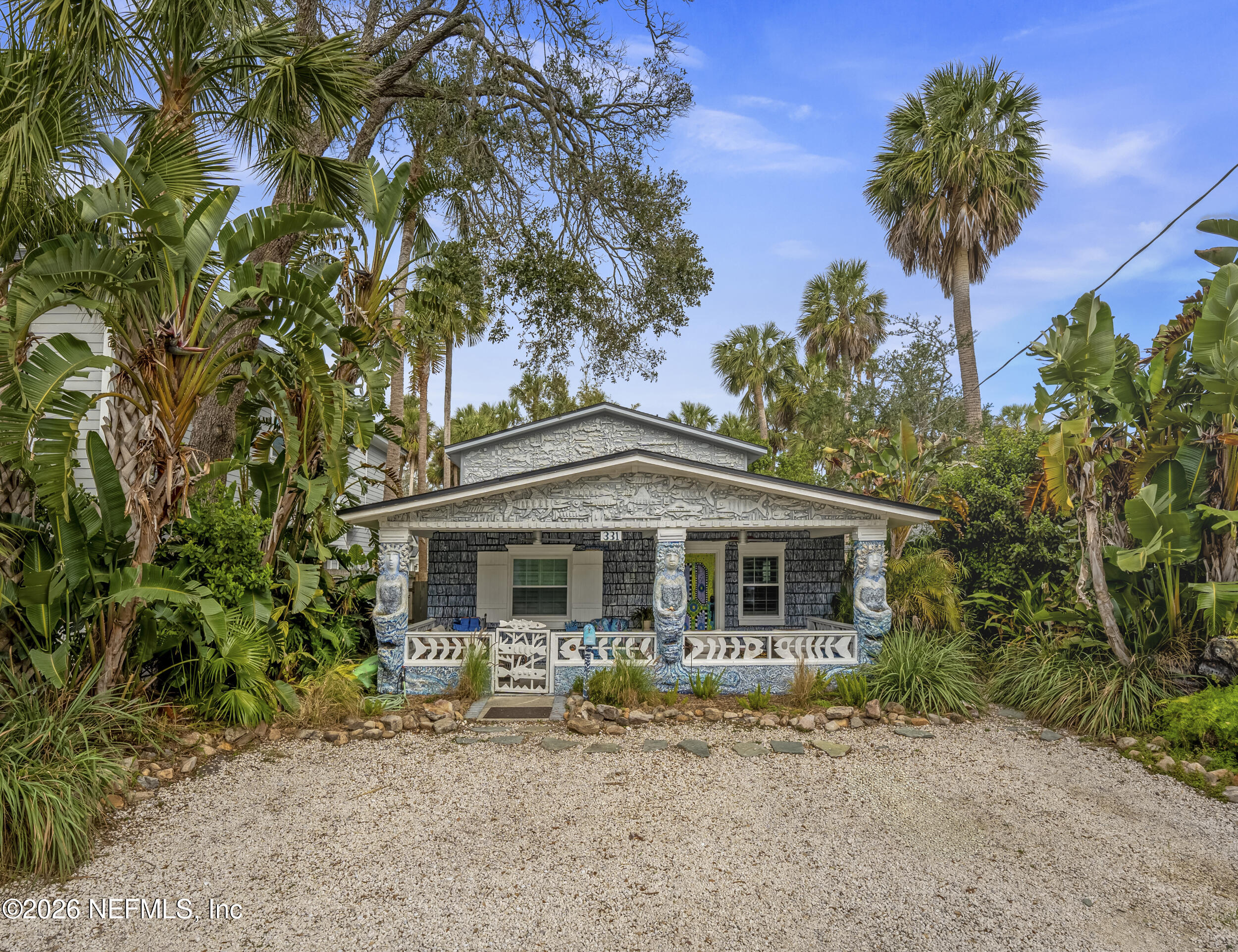 331 10th Street Atlantic Beach, FL 32233 - Photo 1 of 70 a front view of a house with garden
