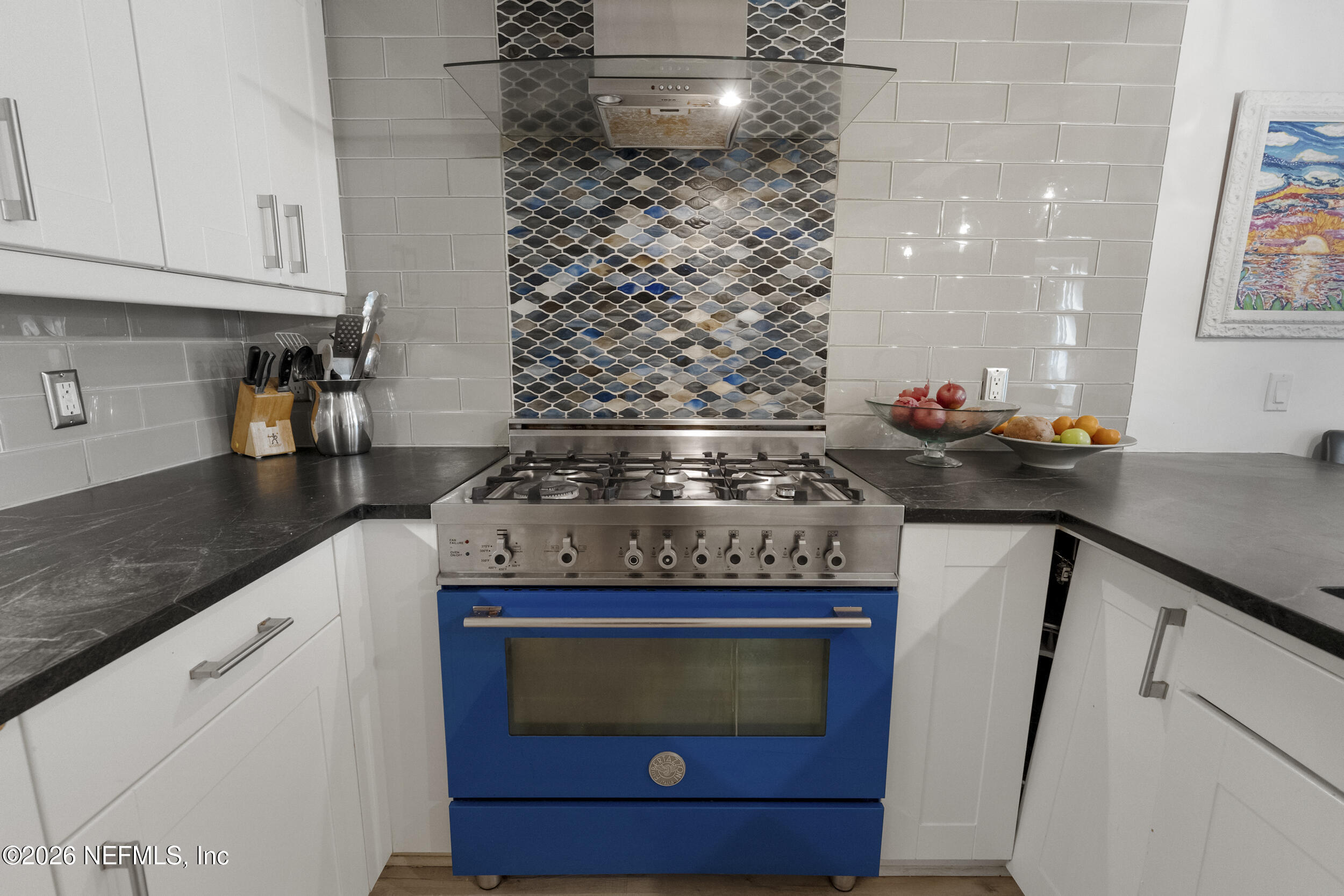 331 10th Street Atlantic Beach, FL 32233 - Photo 13 of 70 a kitchen with a stove and cabinets