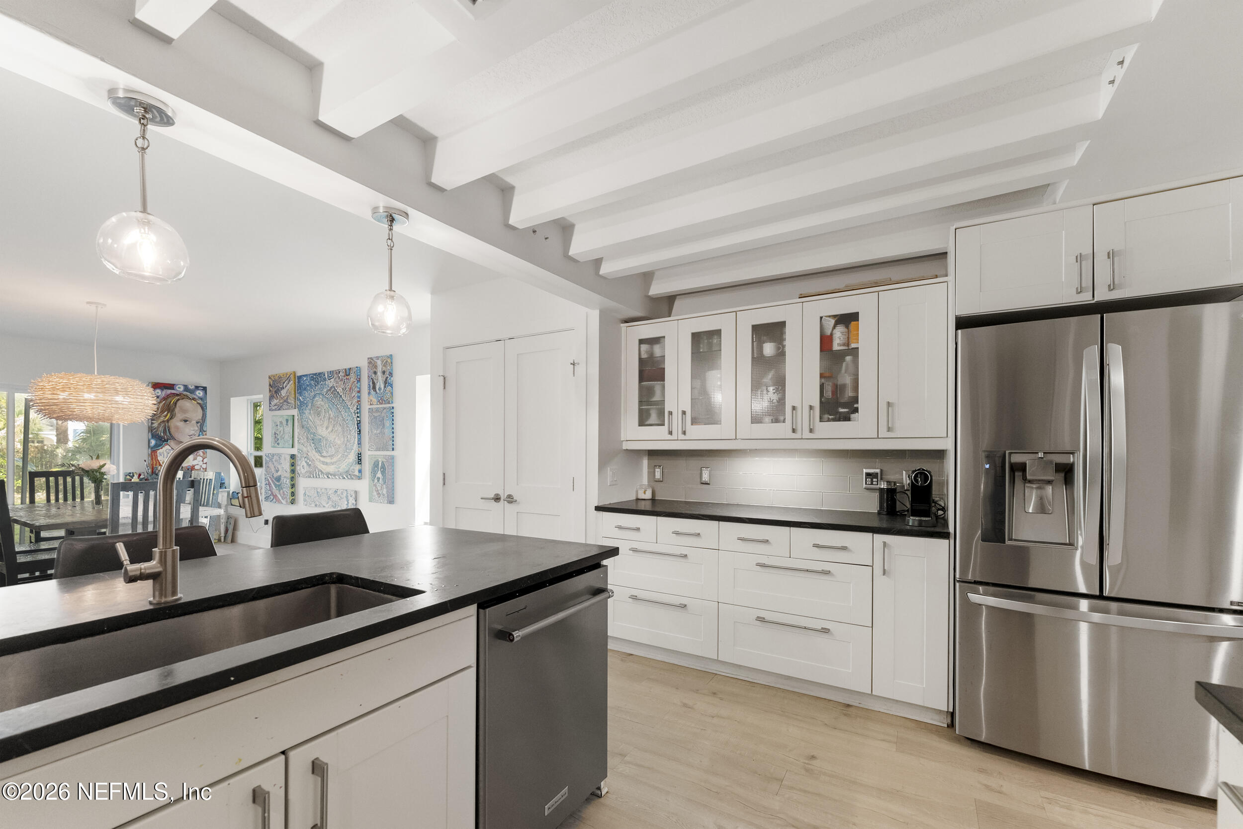 331 10th Street Atlantic Beach, FL 32233 - Photo 15 of 70 a kitchen with granite countertop a sink stainless steel appliances and cabinets
