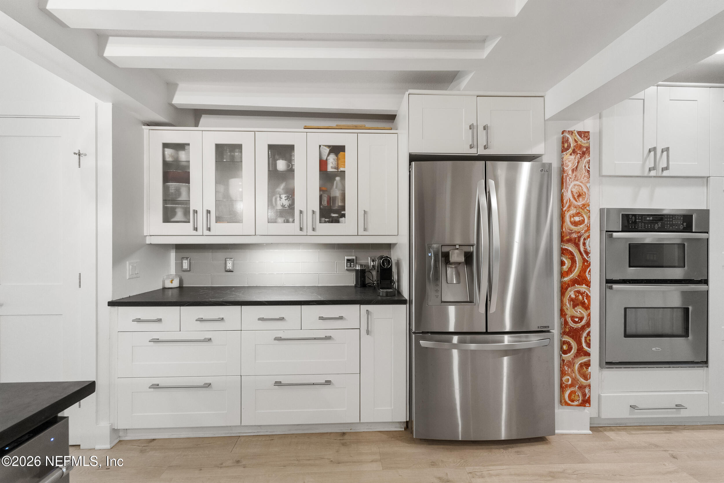 331 10th Street Atlantic Beach, FL 32233 - Photo 16 of 70 a kitchen with granite countertop a refrigerator and a sink