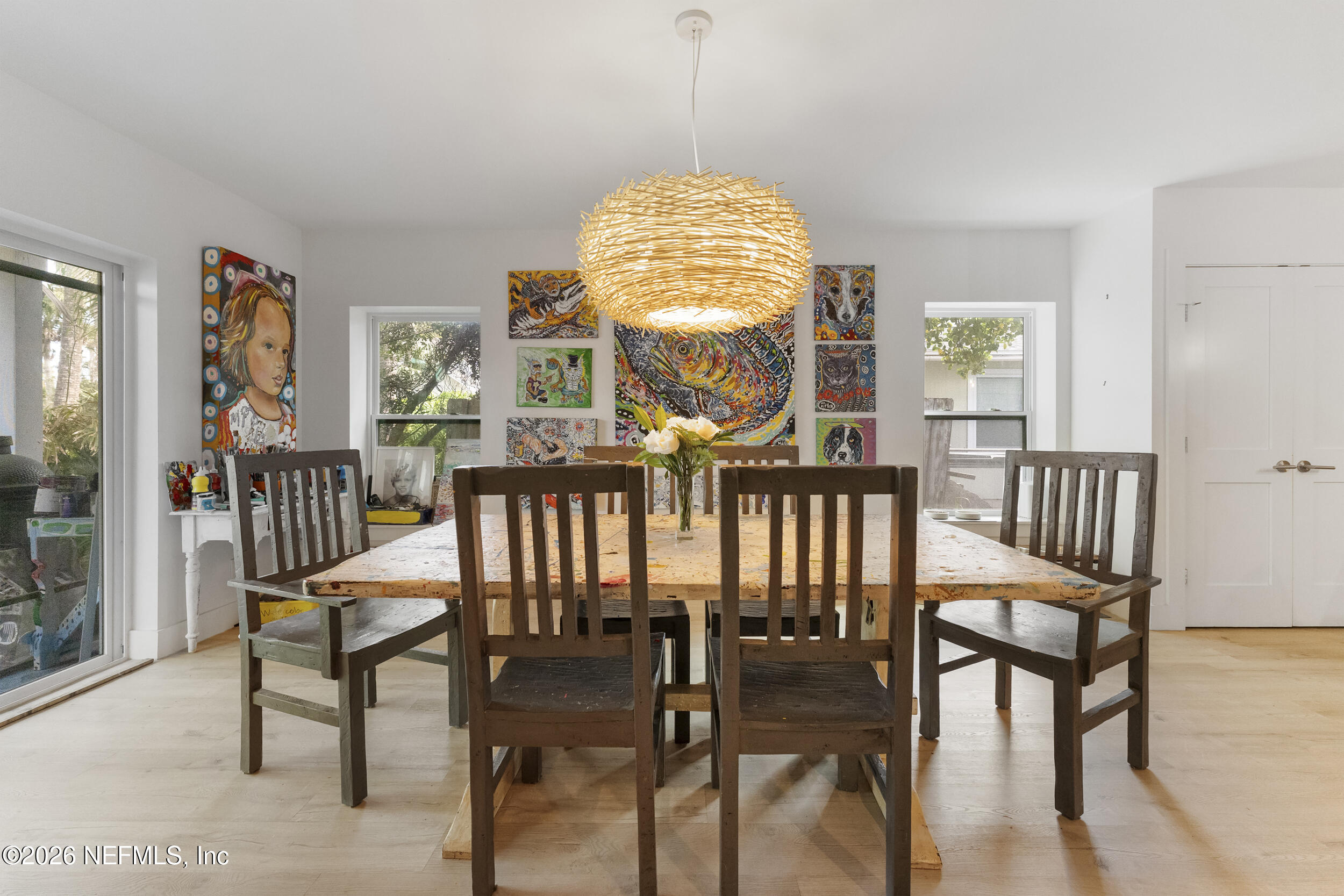 331 10th Street Atlantic Beach, FL 32233 - Photo 17 of 70 a view of a dining room with furniture window and wooden floor