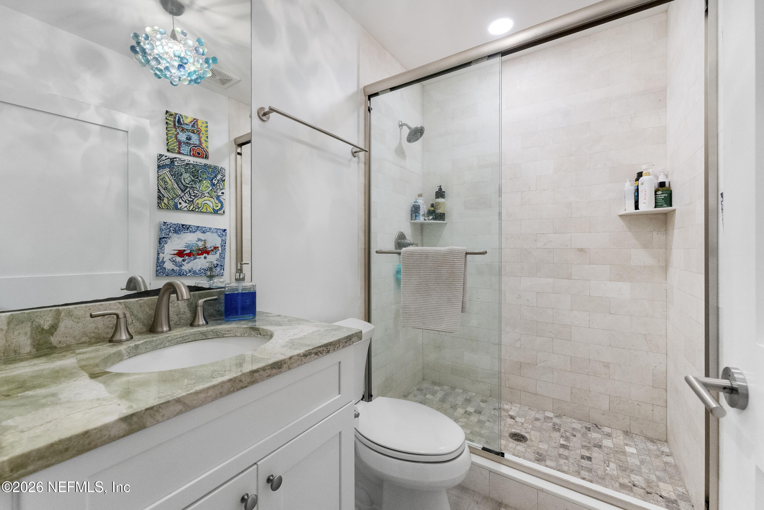 331 10th Street Atlantic Beach, FL 32233 - Photo 26 of 70 a bathroom with a granite countertop sink a toilet a shower and a mirror