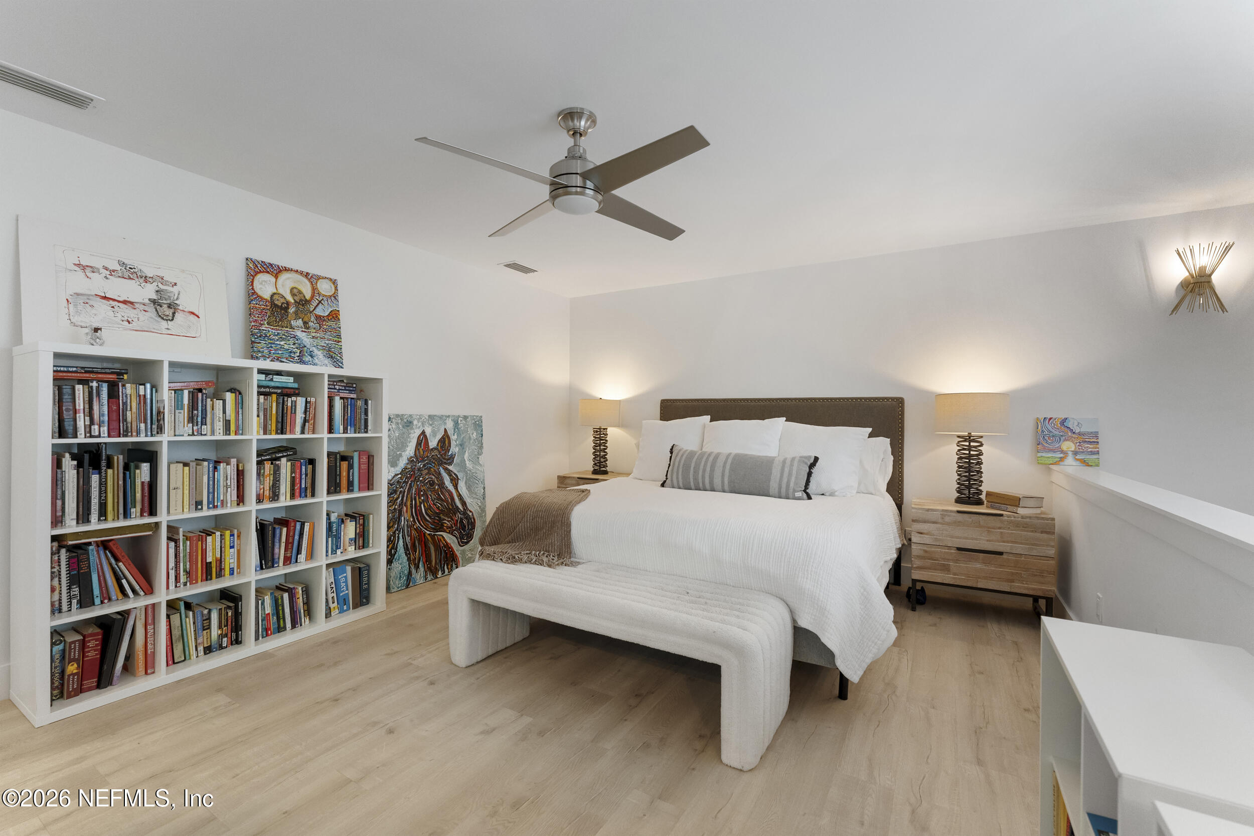 331 10th Street Atlantic Beach, FL 32233 - Photo 30 of 70 a bedroom with a bed and a book shelf