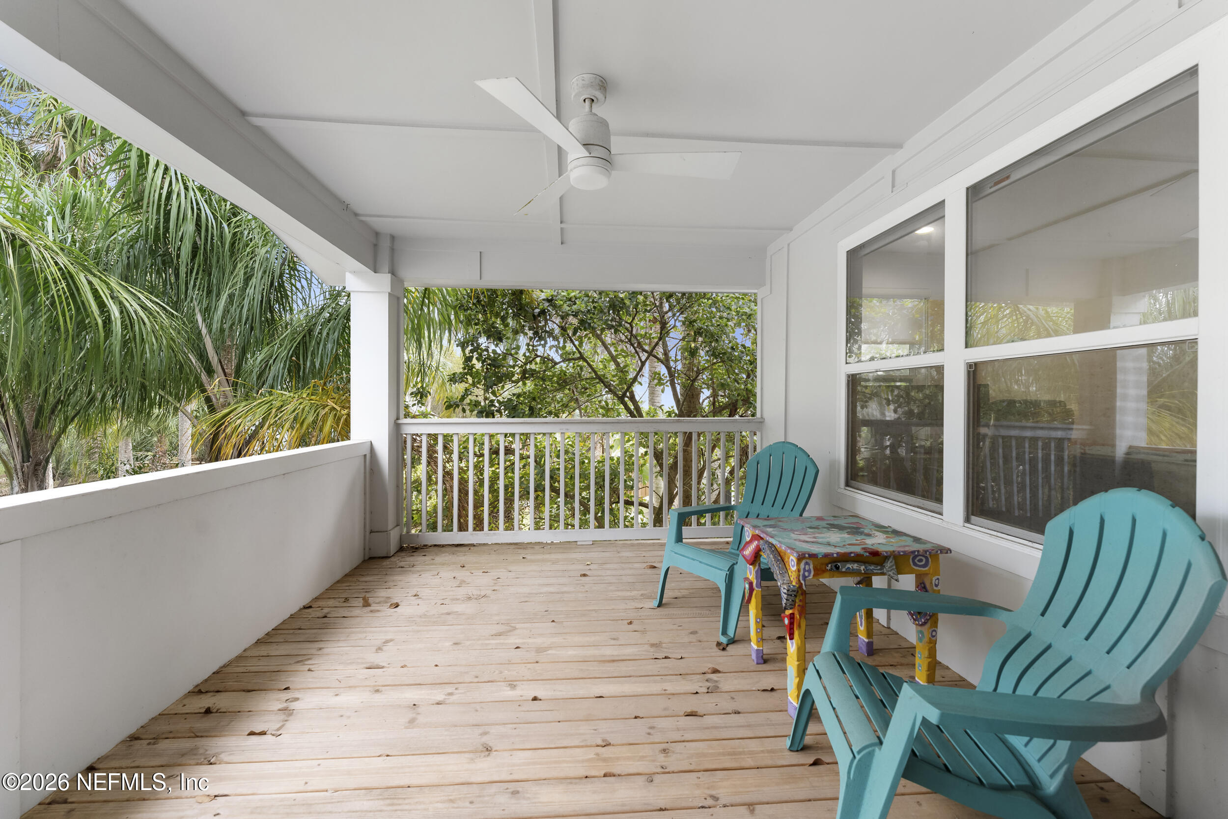 331 10th Street Atlantic Beach, FL 32233 - Photo 32 of 70 a view of a porch with furniture and wooden floor