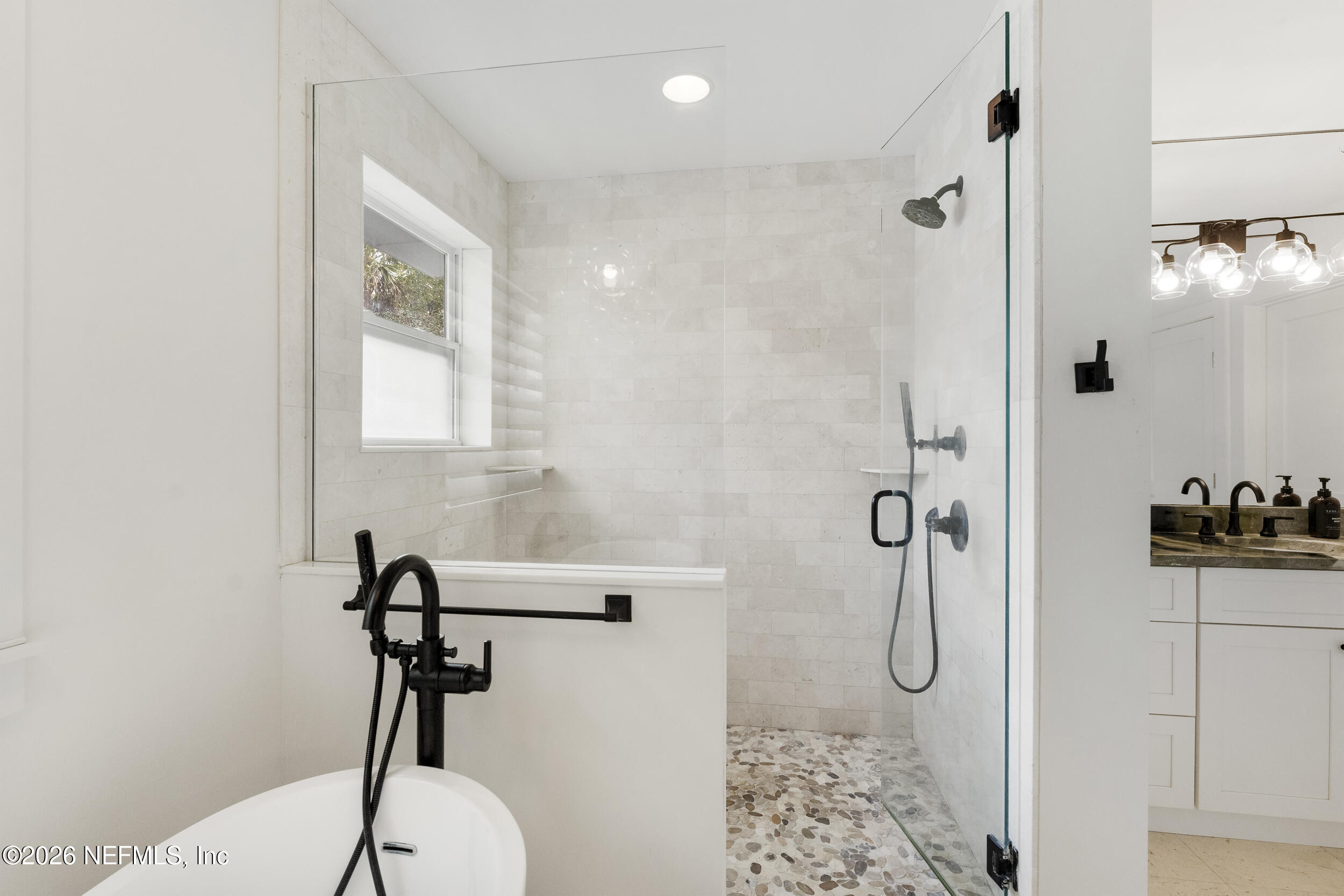 331 10th Street Atlantic Beach, FL 32233 - Photo 34 of 70 a bathroom with a shower