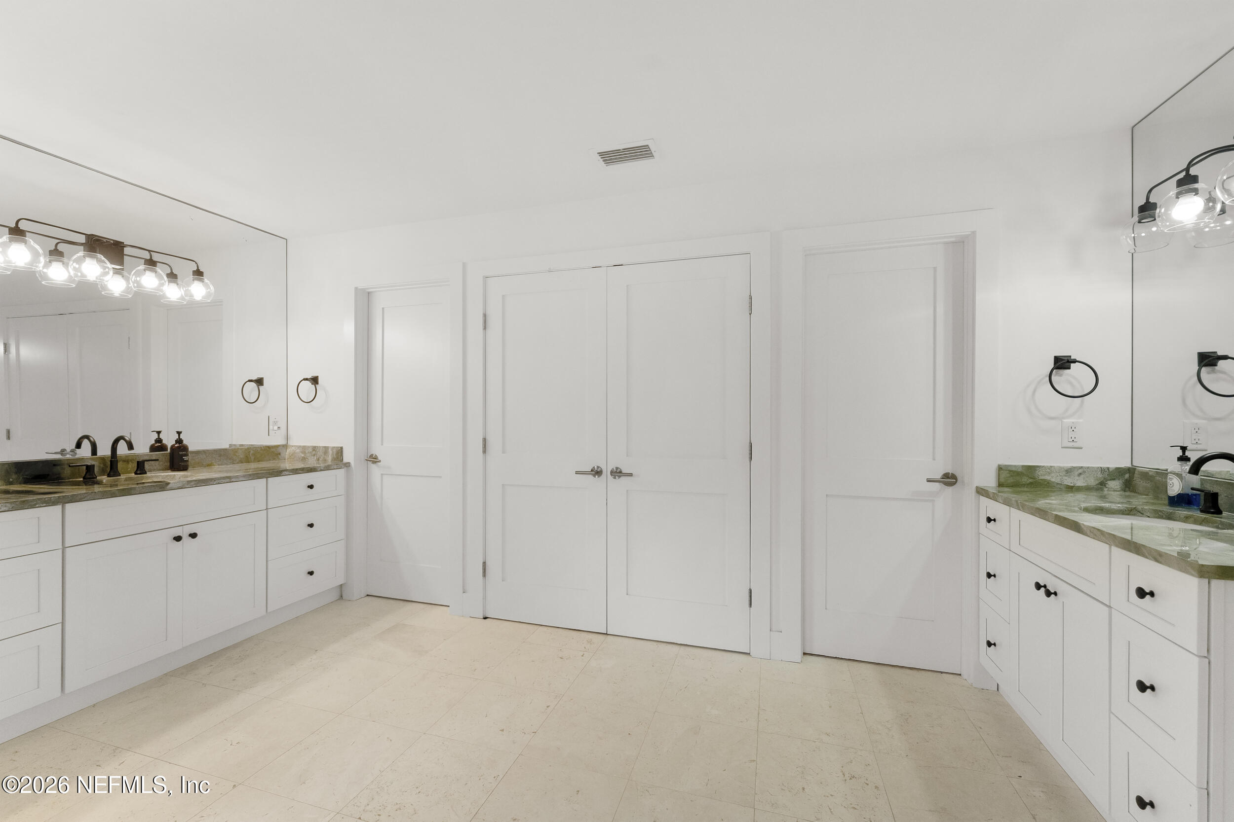 331 10th Street Atlantic Beach, FL 32233 - Photo 37 of 70 a spacious bathroom with a granite countertop double vanity sink mirror and