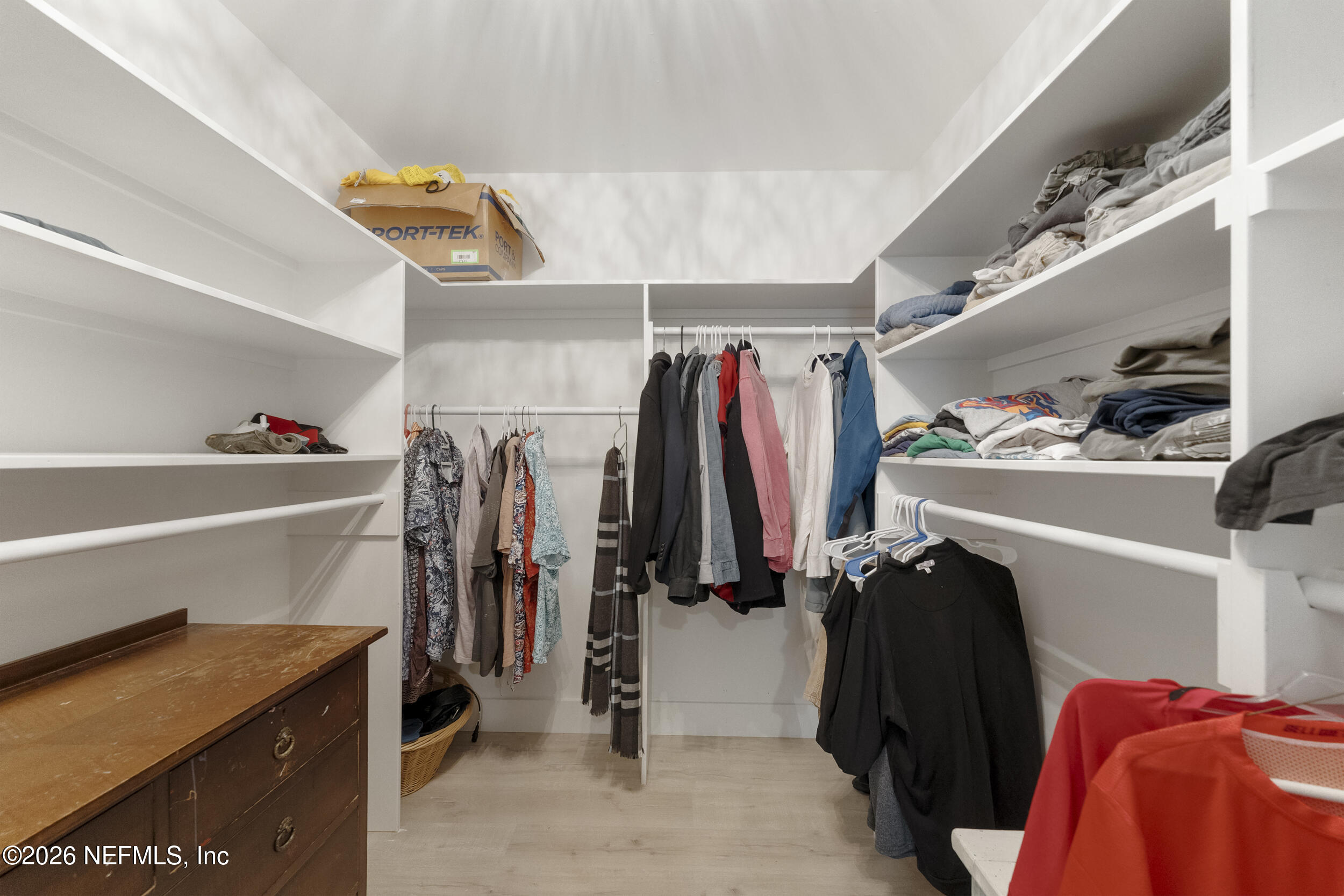 331 10th Street Atlantic Beach, FL 32233 - Photo 41 of 70 a view of walk in closet with clothes and shoes