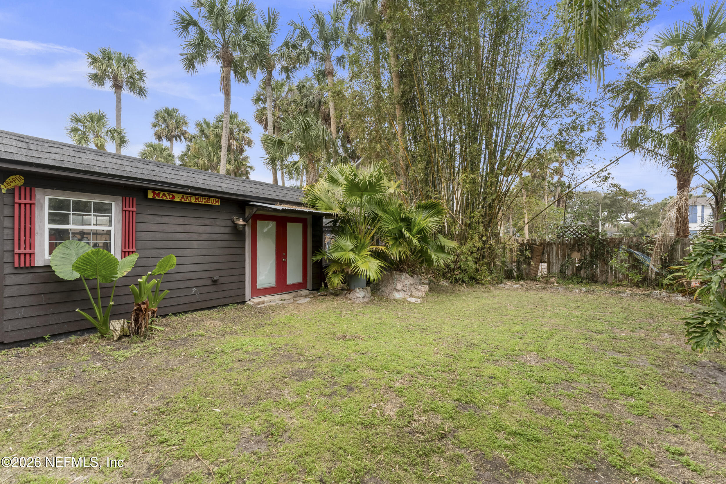 331 10th Street Atlantic Beach, FL 32233 - Photo 45 of 70 a backyard of a house with plants and tree
