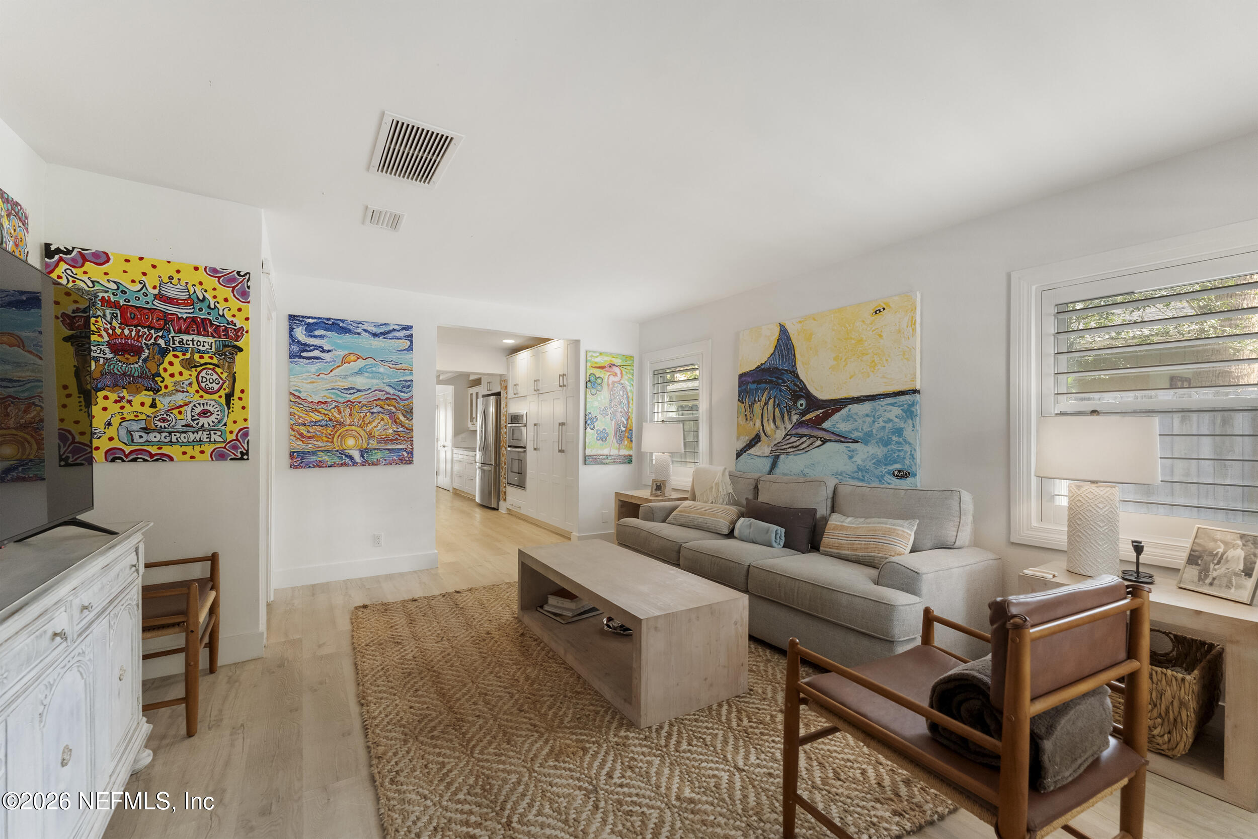 331 10th Street Atlantic Beach, FL 32233 - Photo 7 of 70 a living room with furniture and a flat screen tv