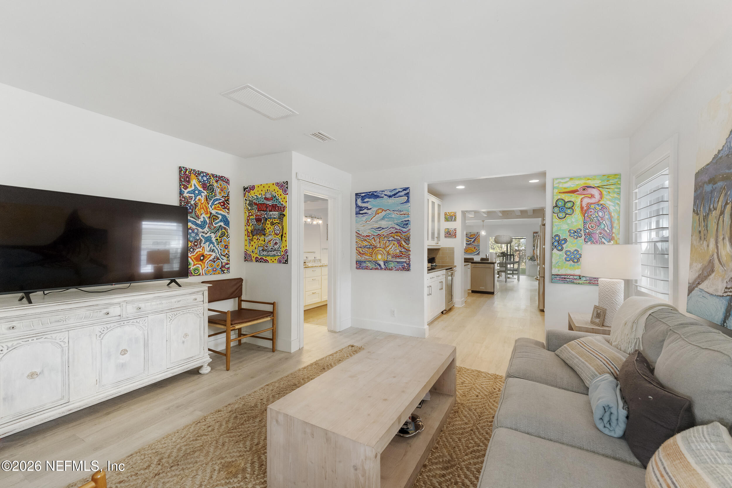 331 10th Street Atlantic Beach, FL 32233 - Photo 8 of 70 a living room with furniture and a flat screen tv