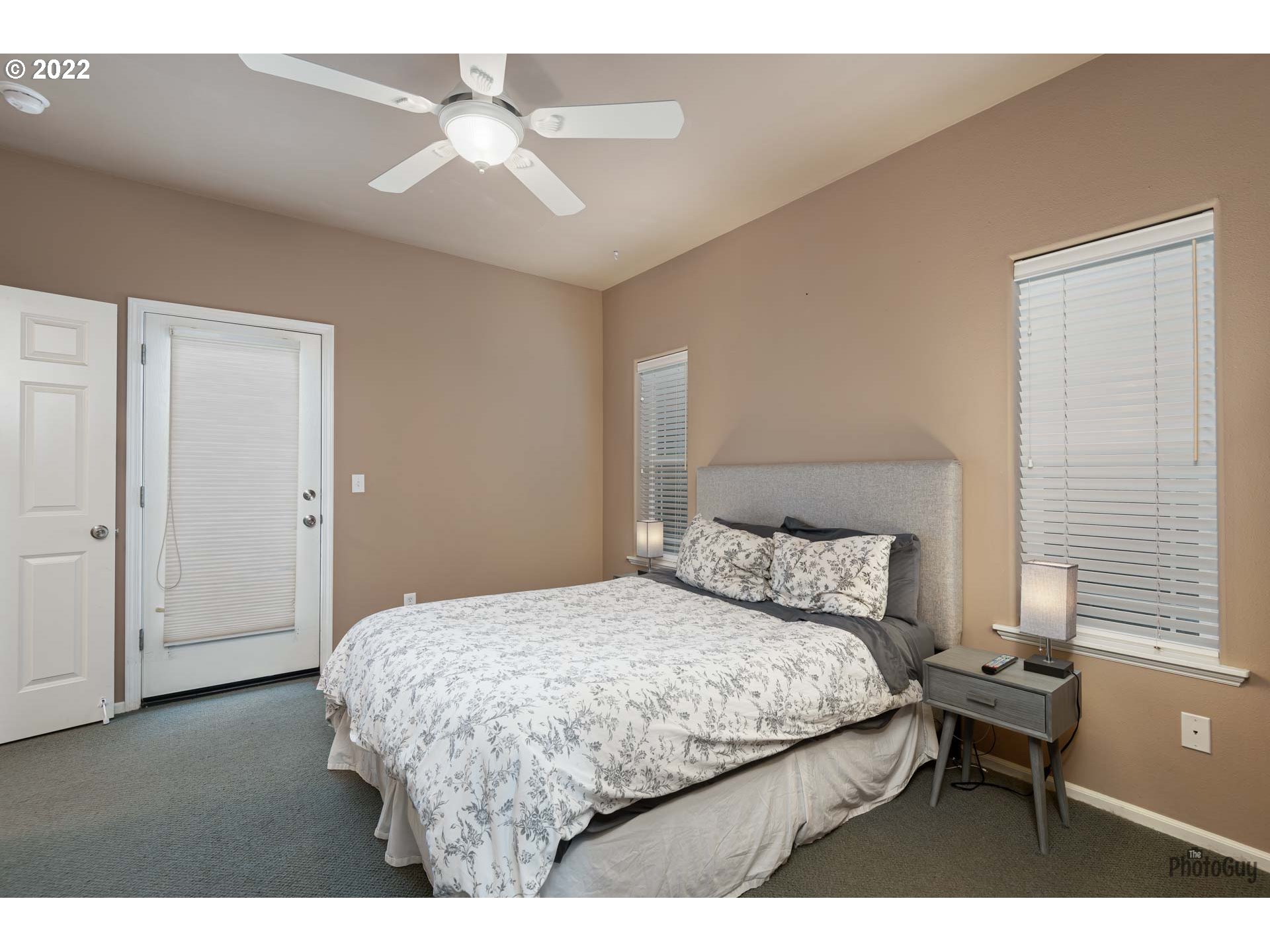 818 South 67th Street Springfield, OR 97478 - Photo 15 of 32 a bedroom with a bed and a chandelier