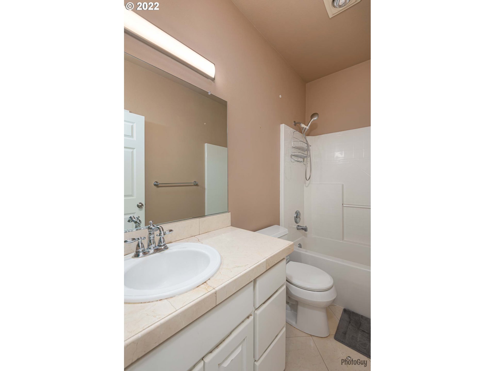 818 South 67th Street Springfield, OR 97478 - Photo 22 of 32 a bathroom with a granite countertop sink a toilet and a mirror