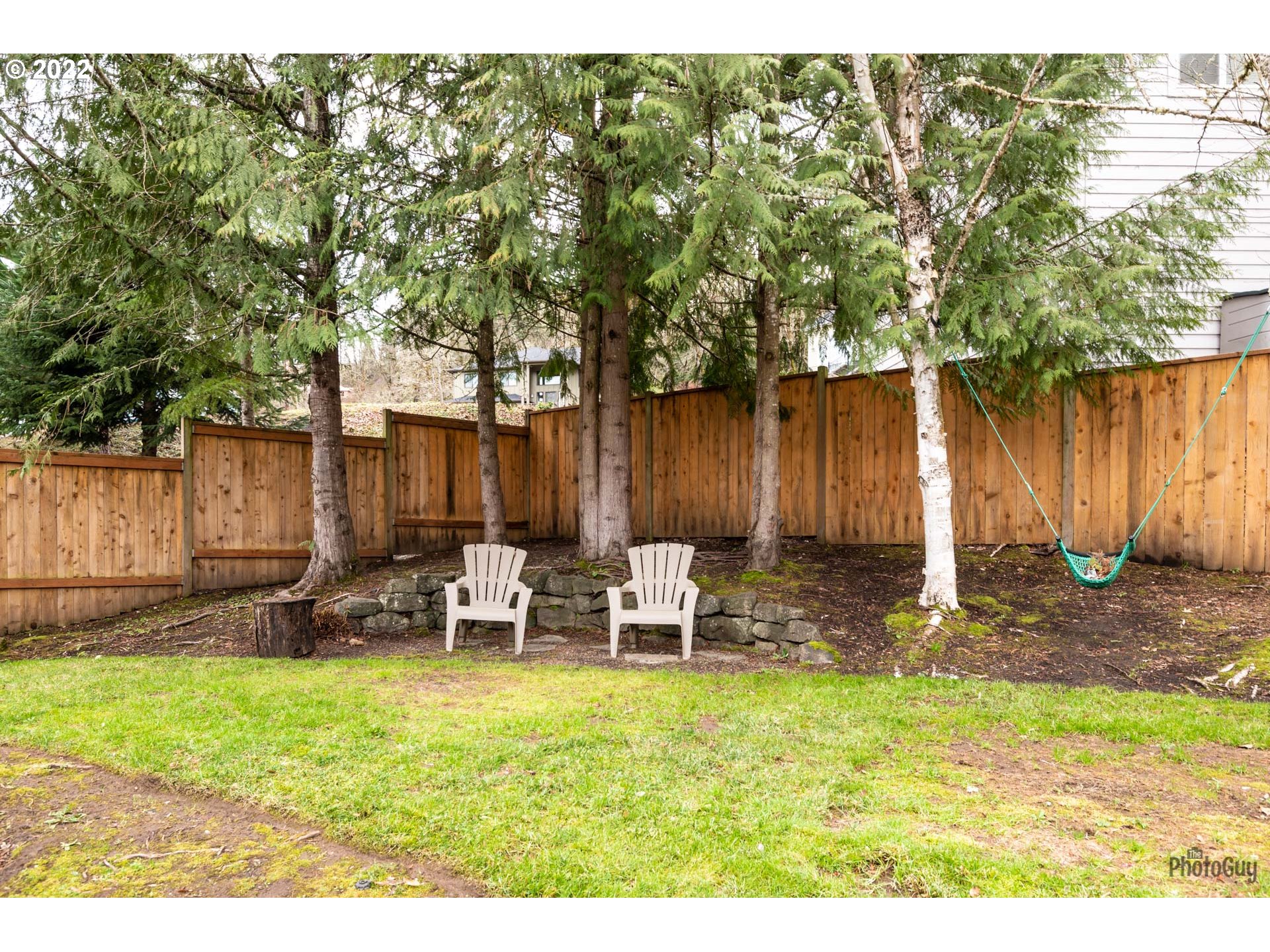 818 South 67th Street Springfield, OR 97478 - Photo 31 of 32 a backyard of a house with table and chairs