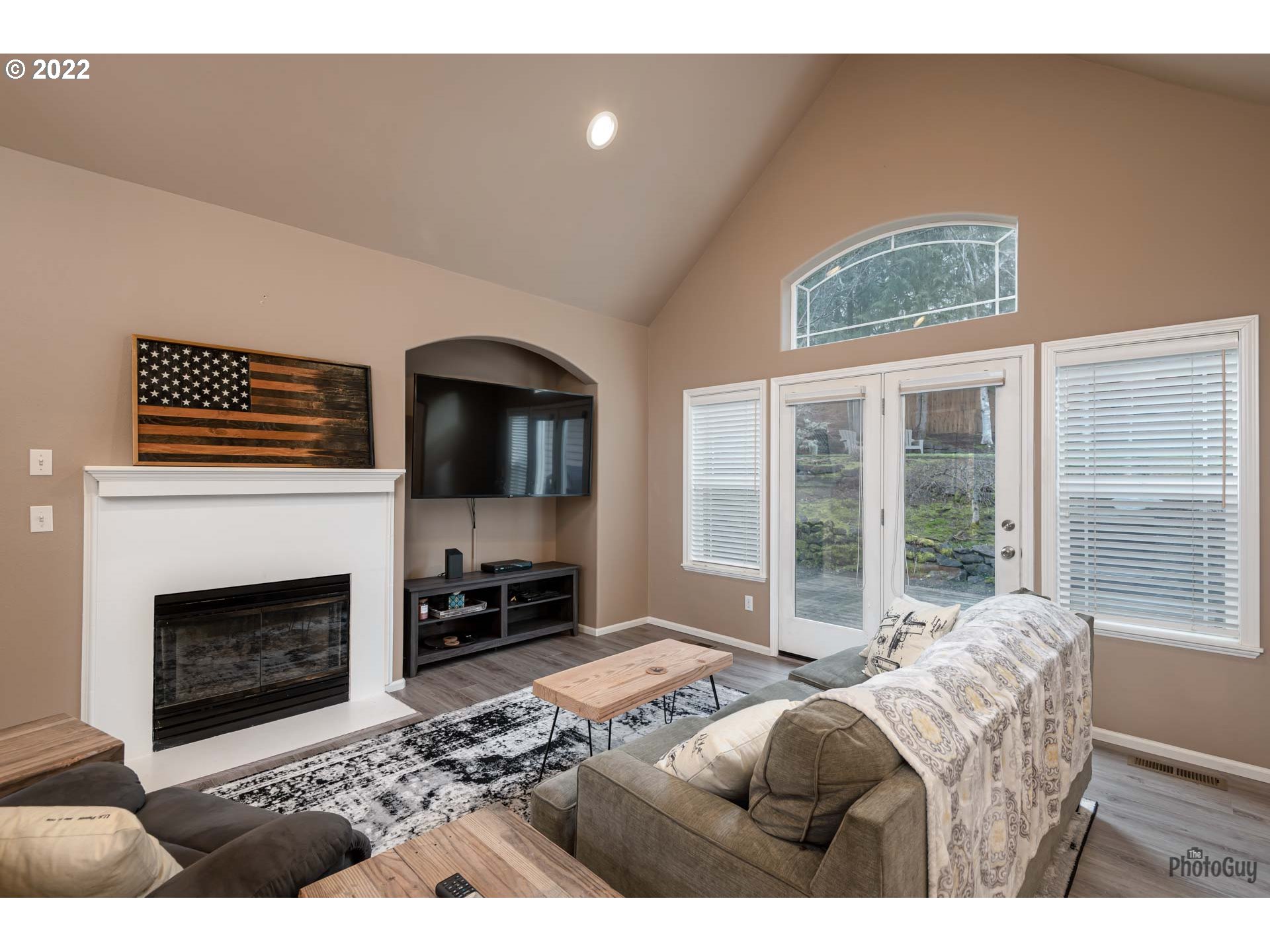 818 South 67th Street Springfield, OR 97478 - Photo 4 of 32 a living room with furniture a flat screen tv and a fireplace
