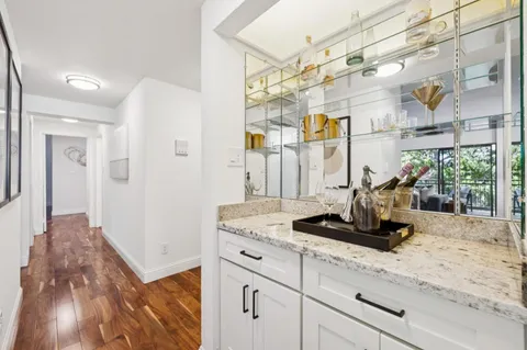 a kitchen with a sink cabinets and window