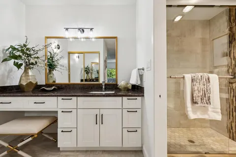 a bathroom with a sink and a mirror