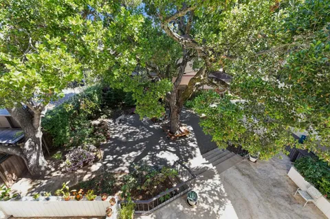 a backyard of a house with table and chairs