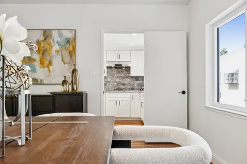 a bedroom with a bed and ceiling fan