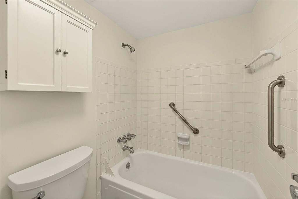 3422 Trophy Boulevard New Port Richey, FL 34655 - Photo 12 of 23 a bathroom with a bathtub and a toilet