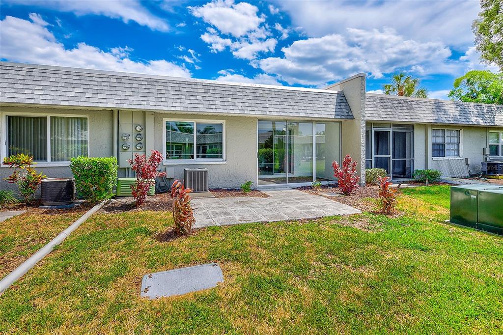 3422 Trophy Boulevard New Port Richey, FL 34655 - Photo 16 of 23 a view of a house with a swimming pool