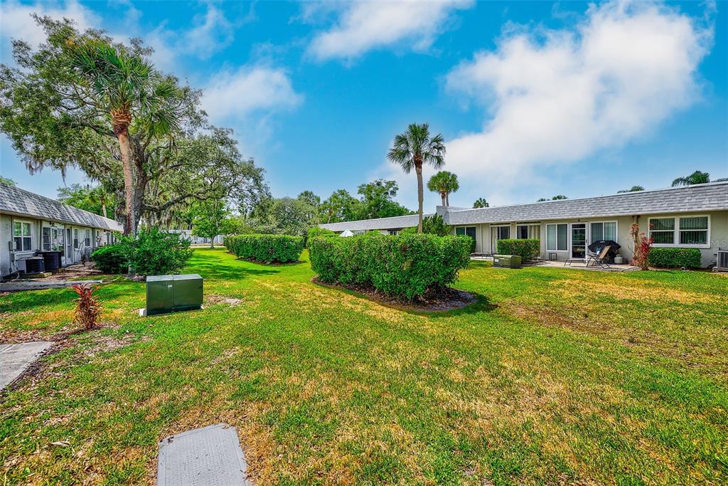 3422 Trophy Boulevard New Port Richey, FL 34655 - Photo 17 of 23 a view of a house with backyard porch and sitting area