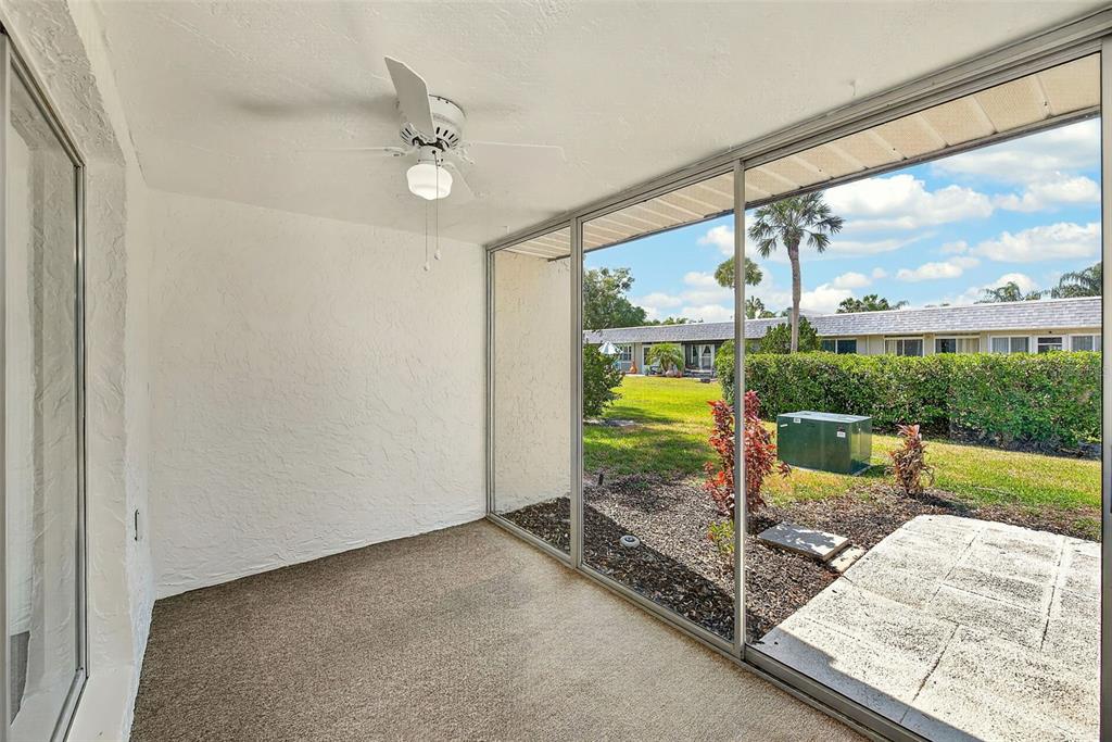 3422 Trophy Boulevard New Port Richey, FL 34655 - Photo 18 of 23 a view of an empty room with a floor to ceiling window and yard