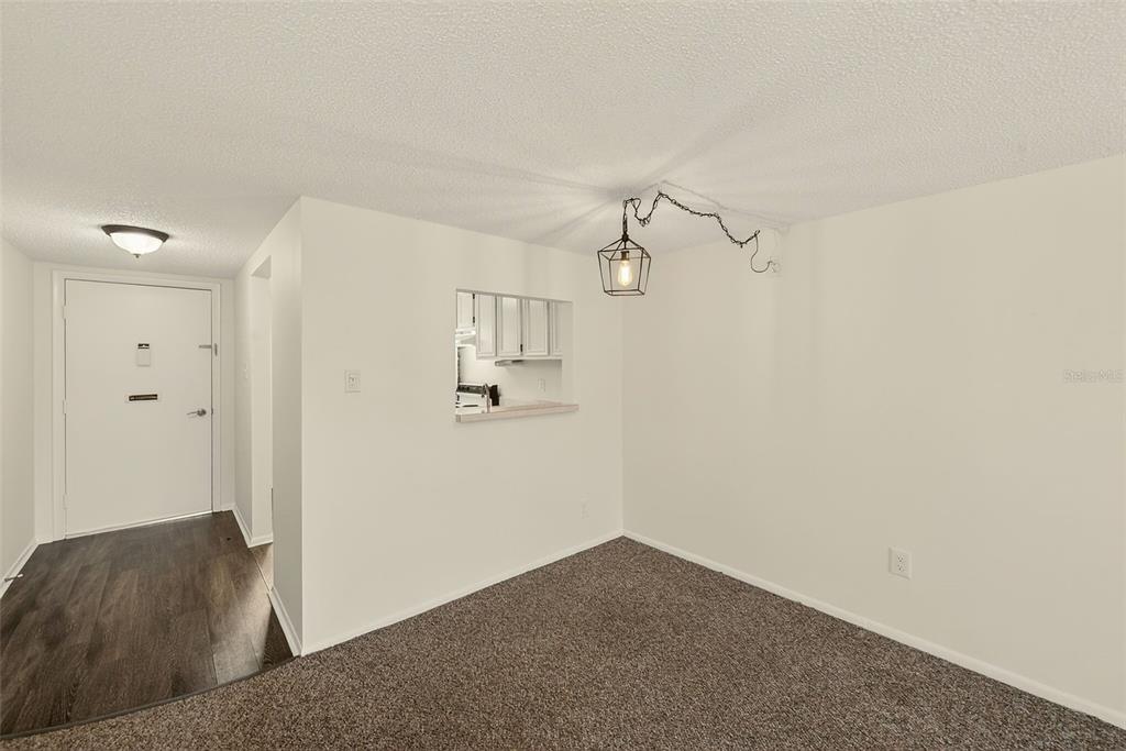 3422 Trophy Boulevard New Port Richey, FL 34655 - Photo 4 of 23 a view of a room with wooden floor closet and windows