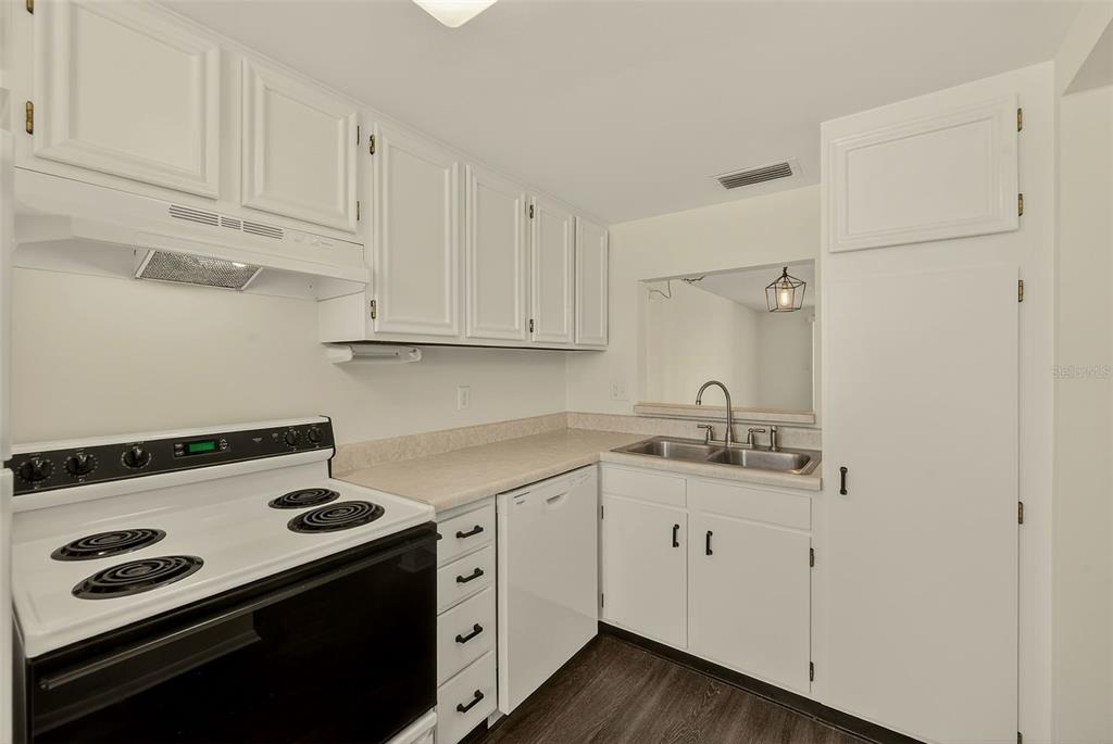 3422 Trophy Boulevard New Port Richey, FL 34655 - Photo 8 of 23 a kitchen with a sink stove and cabinets