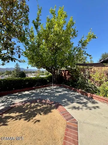 a view of a street with an outdoor space
