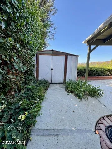 a view of a backyard with plants
