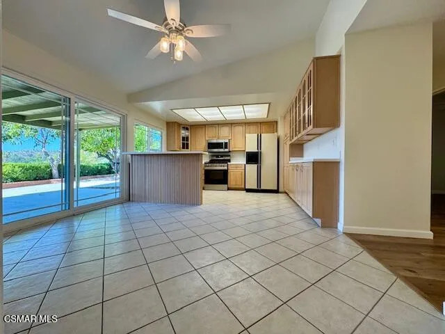a view of a kitchen with furniture and a kitchen