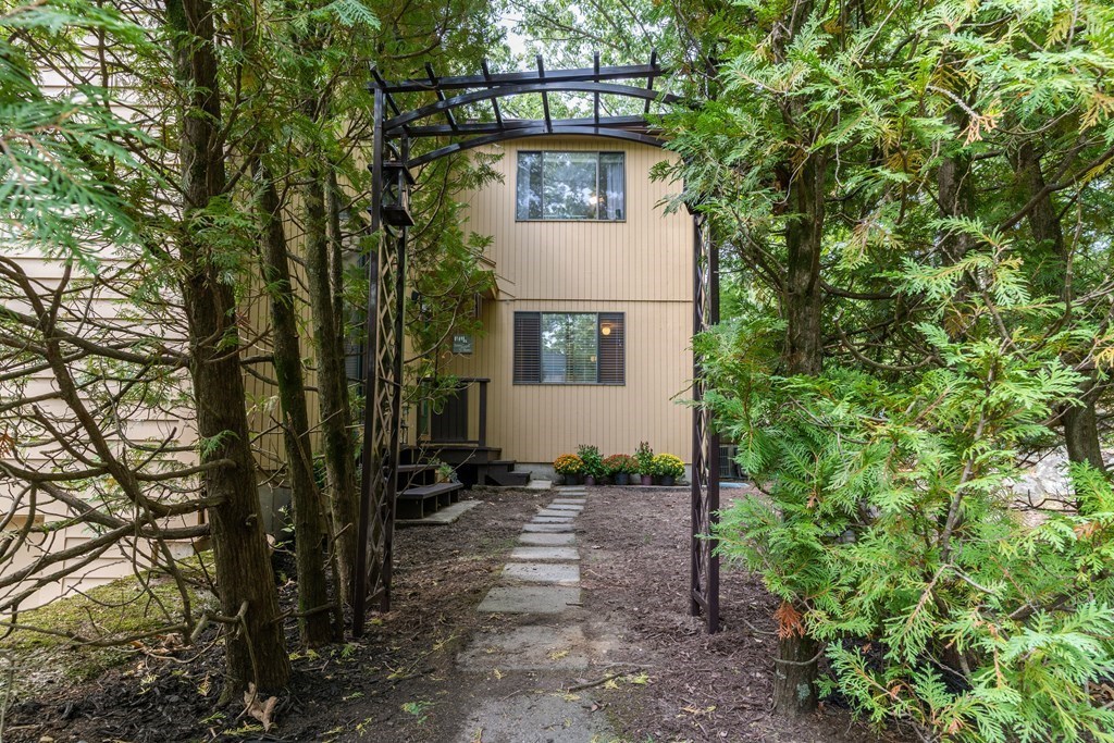 46 Mountain Gate Road, Unit 46 Ashland, MA 01721 - Photo 11 of 14 a view of a house with a tree in the yard