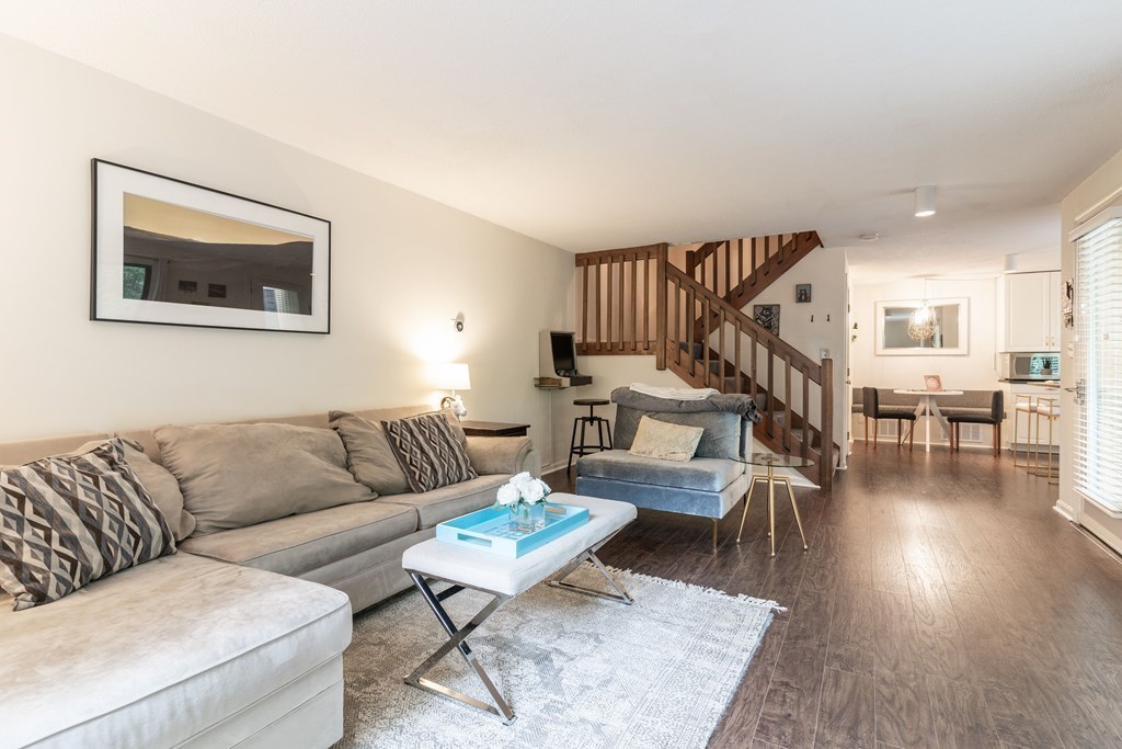 46 Mountain Gate Road, Unit 46 Ashland, MA 01721 - Photo 3 of 14 a living room with furniture and wooden floor